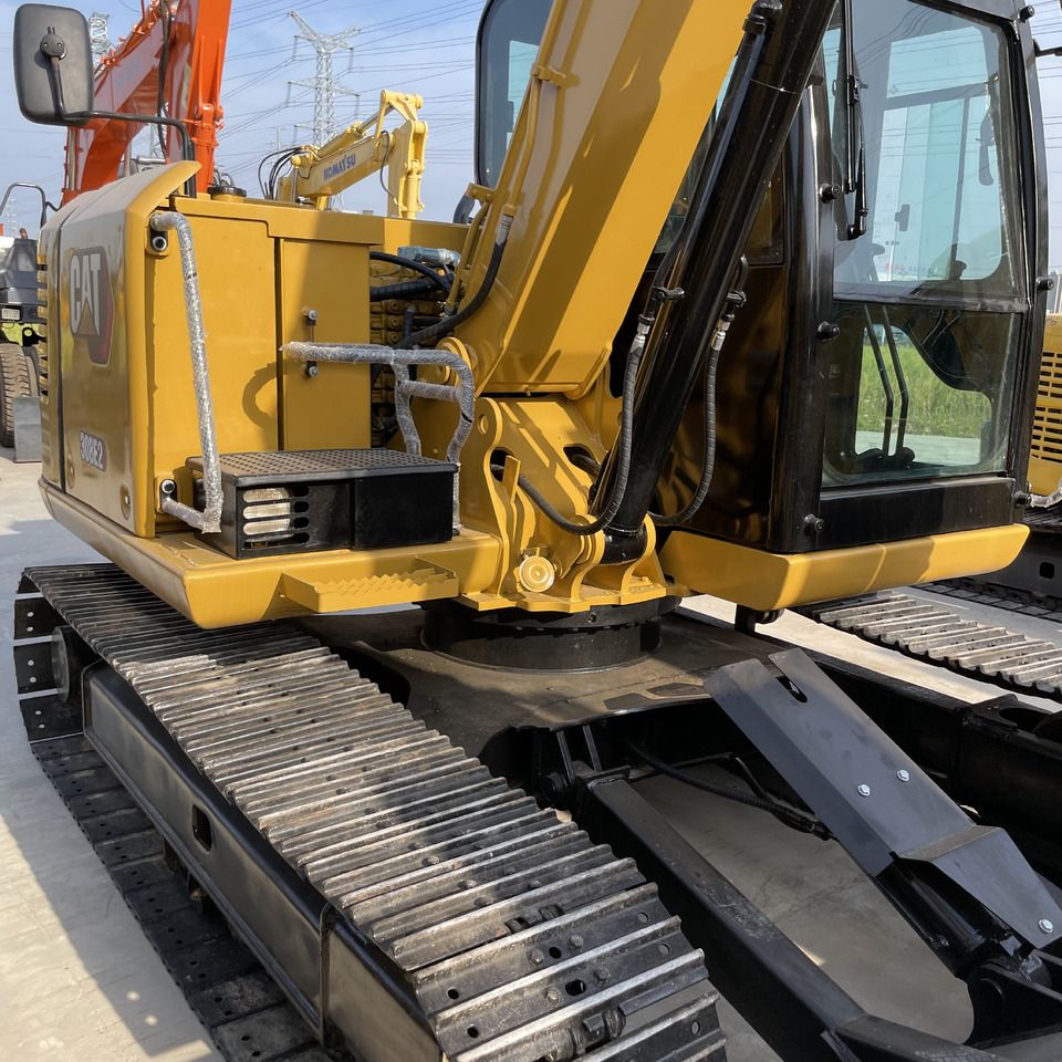 Caterpillar 308E2 mini excavator, rear three-quarter view
