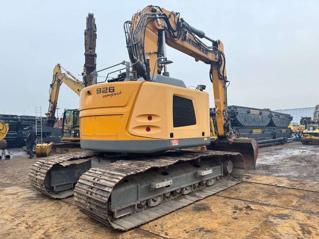 2015 Liebherr R926 Compact crawler excavator, rear three-quarter view 2015 Liebherr R926 Compact crawler excavator, rear three-quarter view