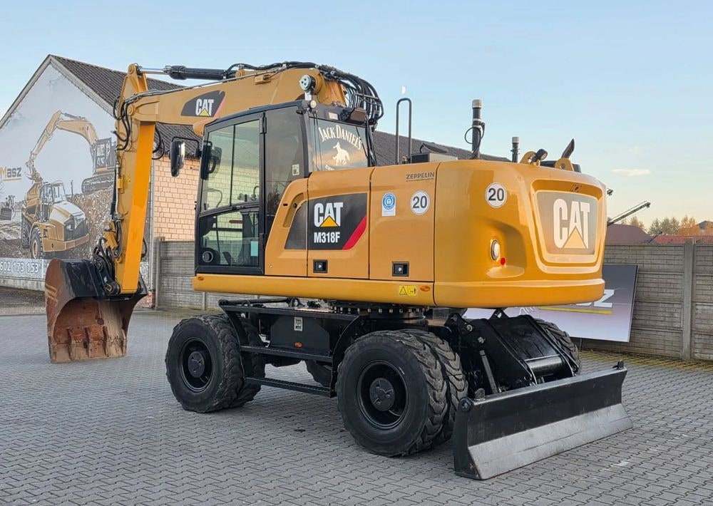 2019 Caterpillar M318F wheel excavator, rear three-quarter view