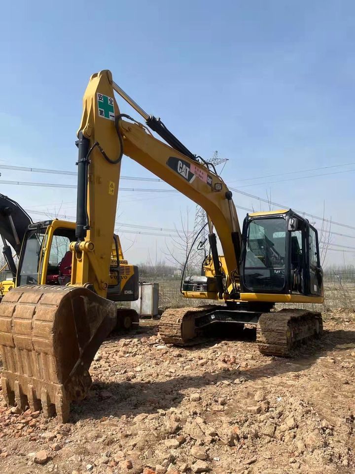 2023 Caterpillar 313D2 crawler excavator, front three-quarter view