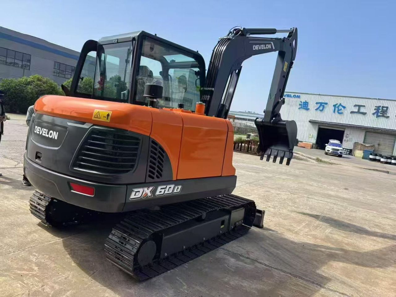 2026 Doosan DX60D mini excavator, rear three-quarter view 2026 Doosan DX60D mini excavator, rear three-quarter view