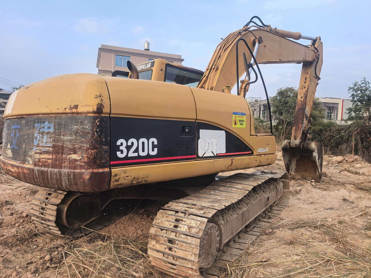 2011 Caterpillar 320C crawler excavator, rear three-quarter view 2011 Caterpillar 320C crawler excavator, rear three-quarter view