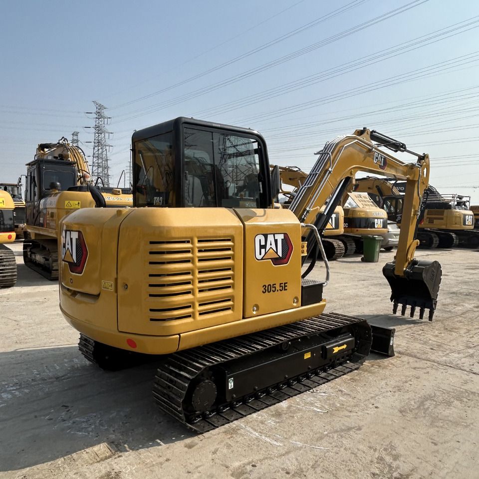 2023 Caterpillar 305.5E mini excavator, rear three-quarter view