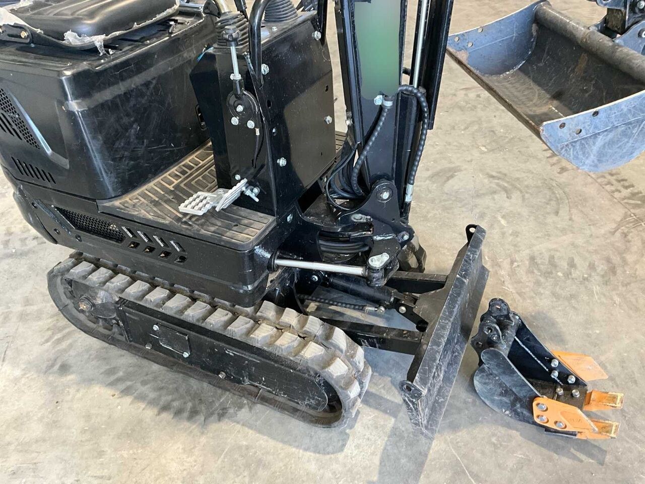2026 Nuoman 1.2T mini excavator, high-angle view of operator station and tracks 2026 Nuoman 1.2T mini excavator, high-angle view of operator station and tracks