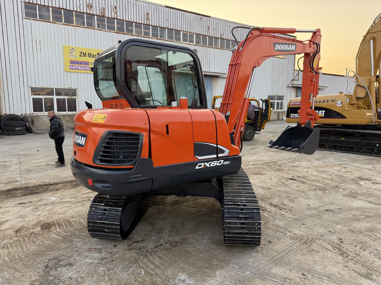 2023 Doosan DX60-9C crawler excavator, rear three-quarter view 2023 Doosan DX60-9C crawler excavator, rear three-quarter view