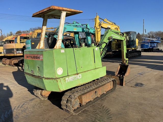 Mitsubishi ME30 mini excavator, rear three-quarter view