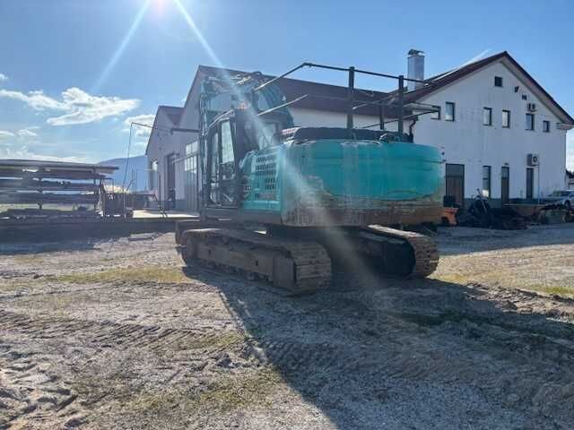 2018 Kobelco SK210HLC-10 crawler excavator, rear three-quarter view 2018 Kobelco SK210HLC-10 crawler excavator, rear three-quarter view