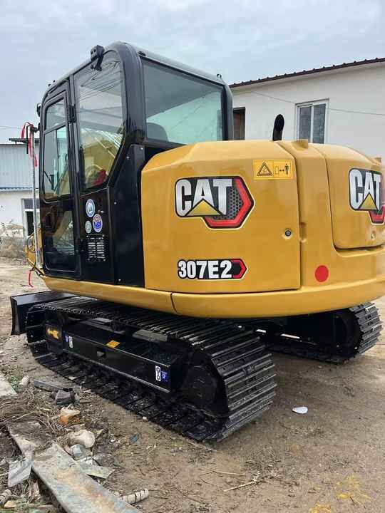 2024 Caterpillar 307E2 mini excavator, rear three-quarter view 2024 Caterpillar 307E2 mini excavator, rear three-quarter view