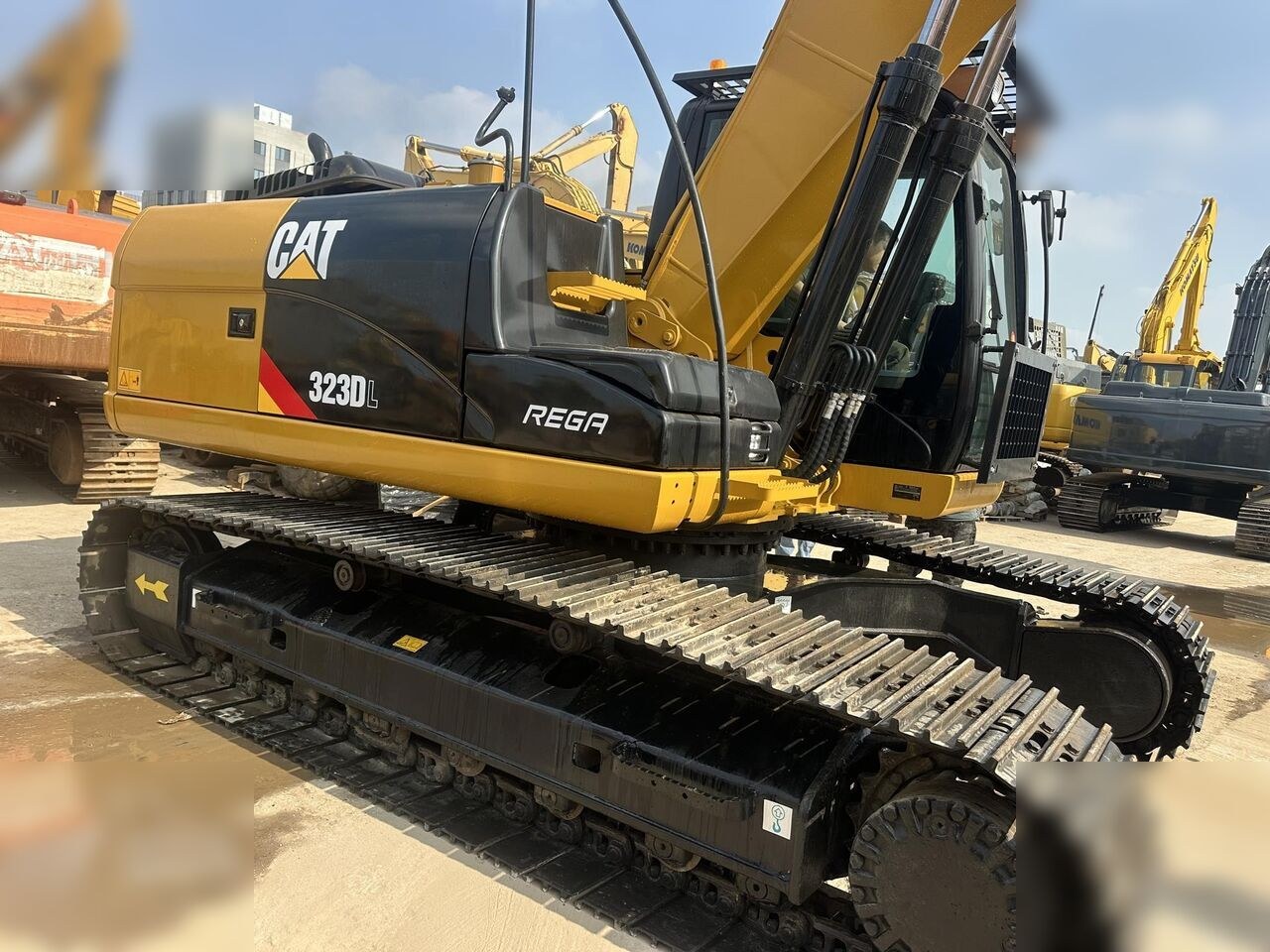 2023 Caterpillar 323DL crawler excavator side view