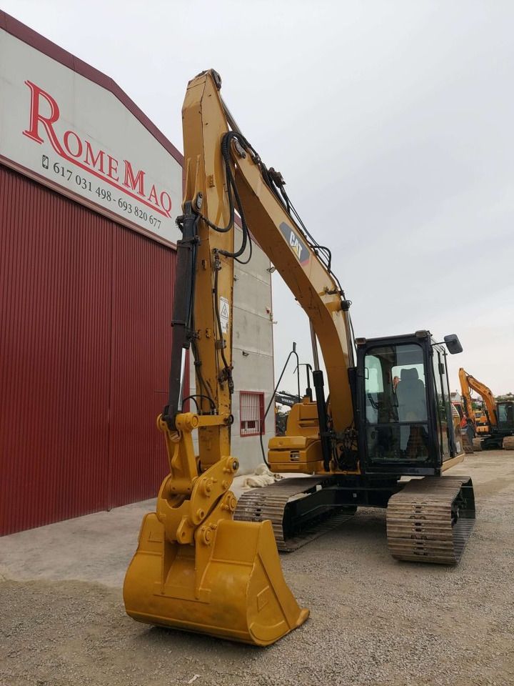 2010 Caterpillar 312D crawler excavator, front three-quarter view 2010 Caterpillar 312D crawler excavator, front three-quarter view
