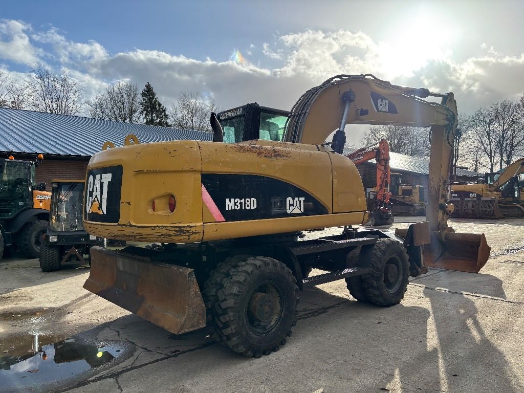 2008 Caterpillar M318D wheel excavator, rear three-quarter view 2008 Caterpillar M318D wheel excavator, rear three-quarter view