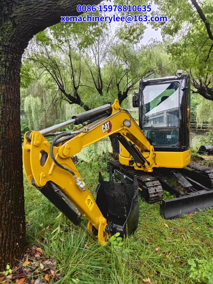 2024 Caterpillar 303.5E mini excavator, front three-quarter view