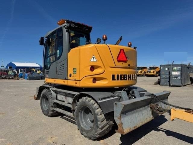 2016 Liebherr A910 COMPACT wheel excavator, rear three-quarter view 2016 Liebherr A910 COMPACT wheel excavator, rear three-quarter view