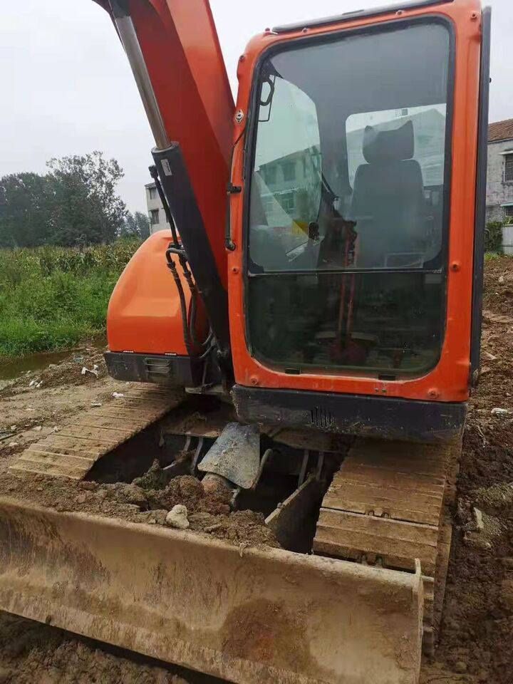 Doosan DX75-9C excavator, front-side view Doosan DX75-9C excavator, front-side view