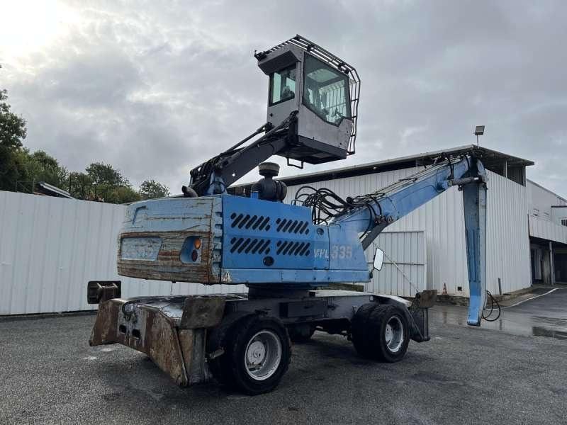 2011 Fuchs MHL335 material handler, rear three-quarter view