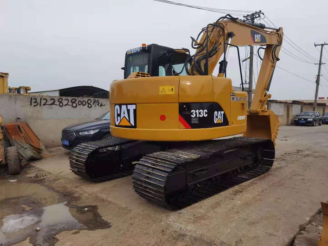 2010 Caterpillar 313C SR crawler excavator, rear three-quarter view 2010 Caterpillar 313C SR crawler excavator, rear three-quarter view