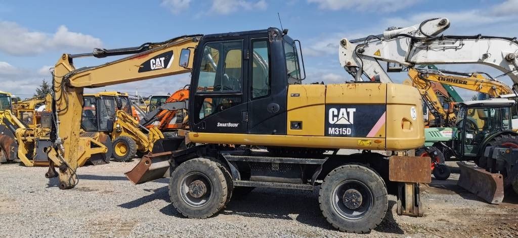 2011 Caterpillar M315D wheel excavator, side profile view