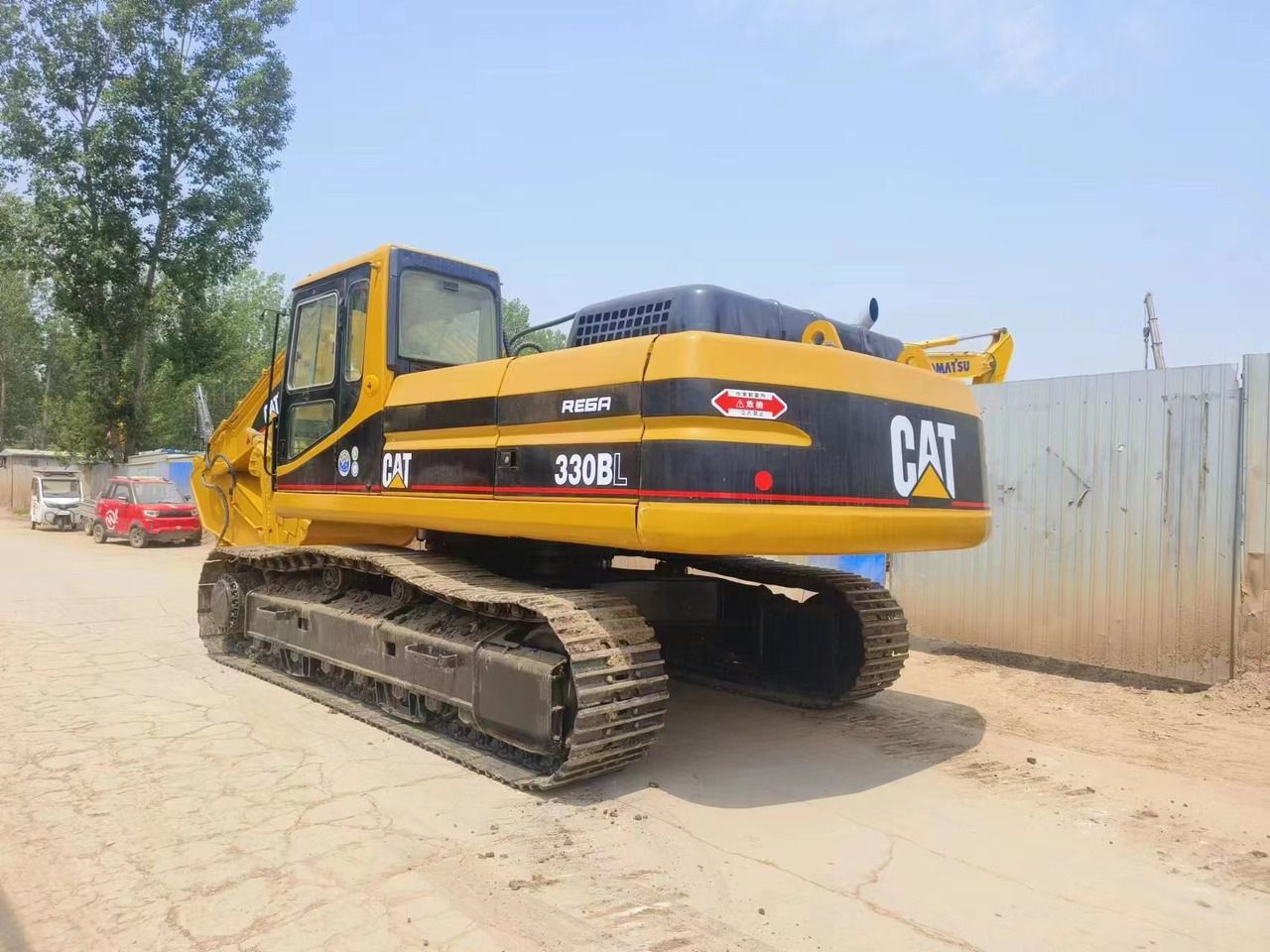 Caterpillar 330BL crawler excavator rear three-quarter view Caterpillar 330BL crawler excavator rear three-quarter view