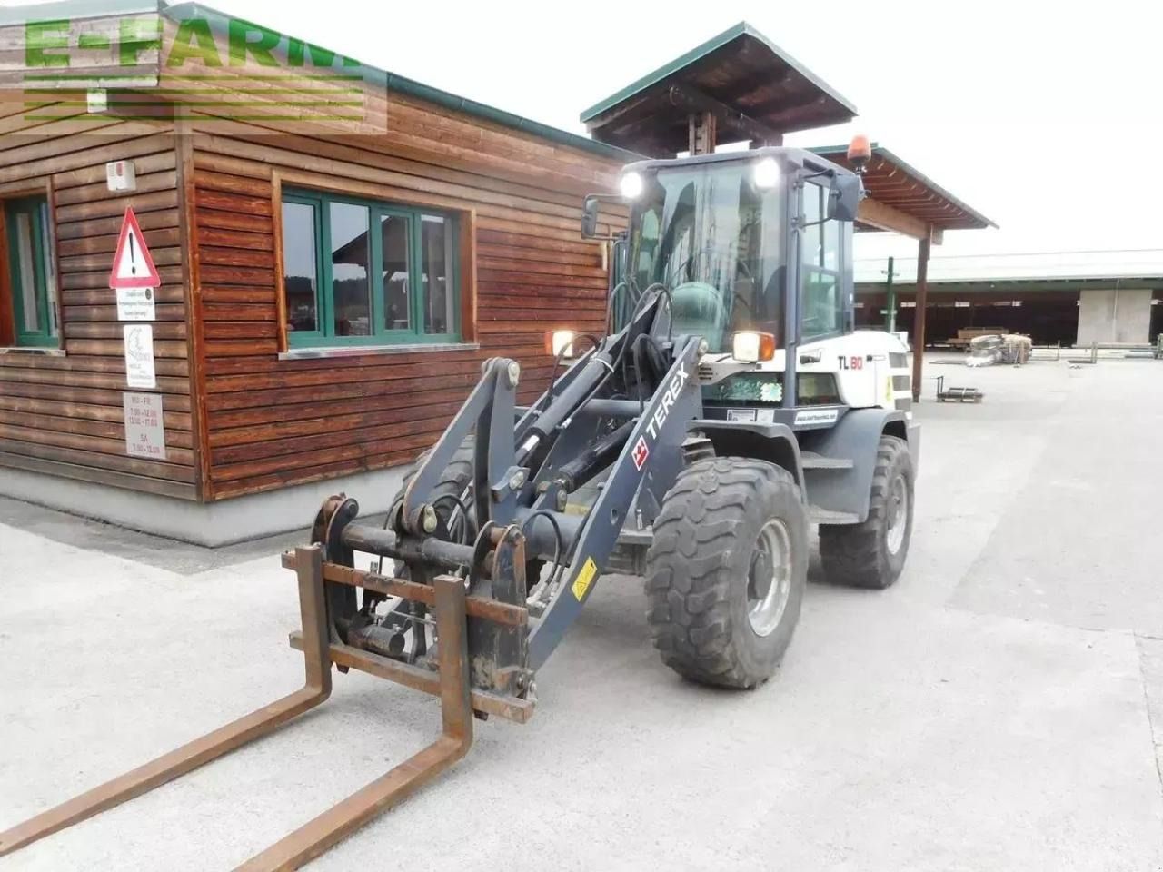 2016 Terex TL80 wheel loader with forks, front three-quarter view 2016 Terex TL80 wheel loader with forks, front three-quarter view
