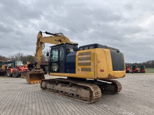 2017 Caterpillar 326FLN crawler excavator, rear three-quarter view 2017 Caterpillar 326FLN crawler excavator, rear three-quarter view