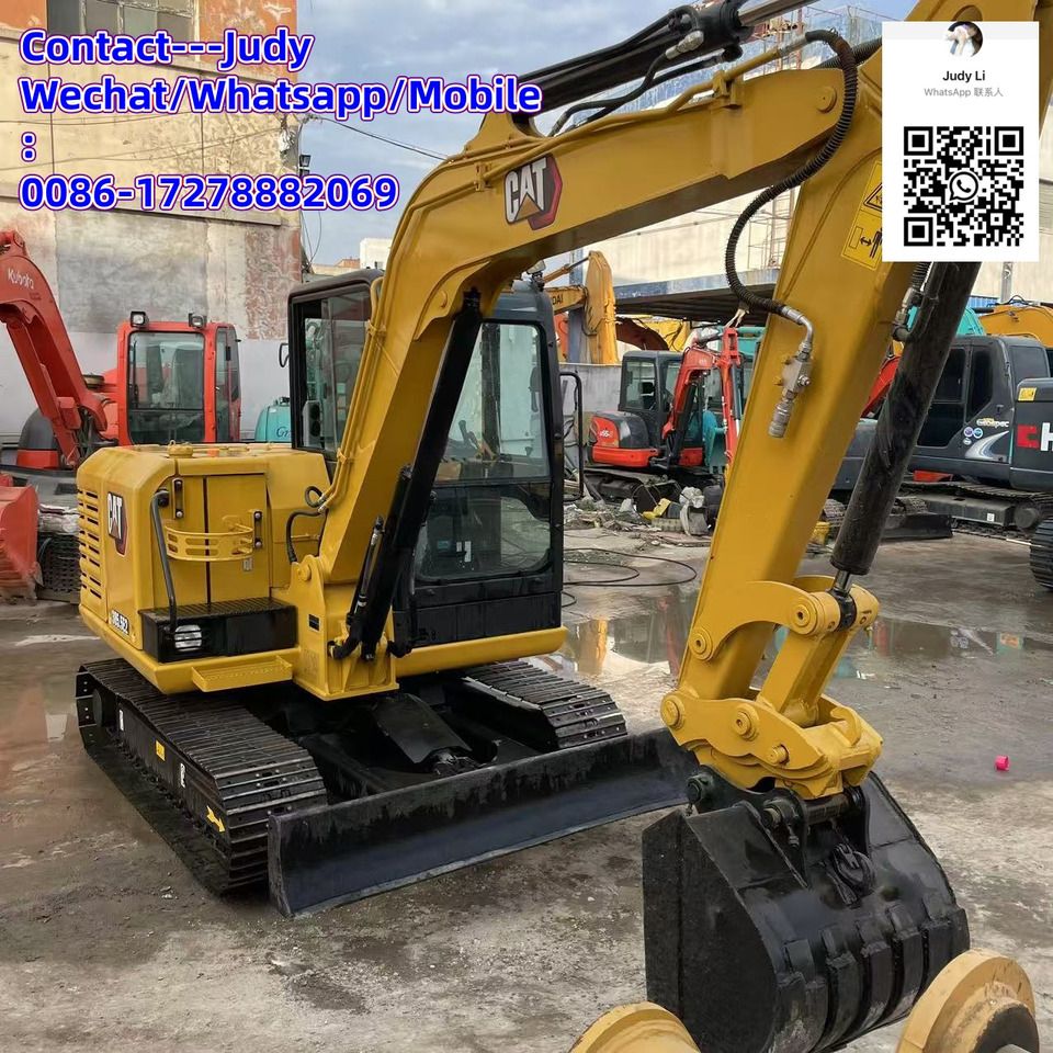 2024 Caterpillar 305.5E2 mini excavator, front three-quarter view
