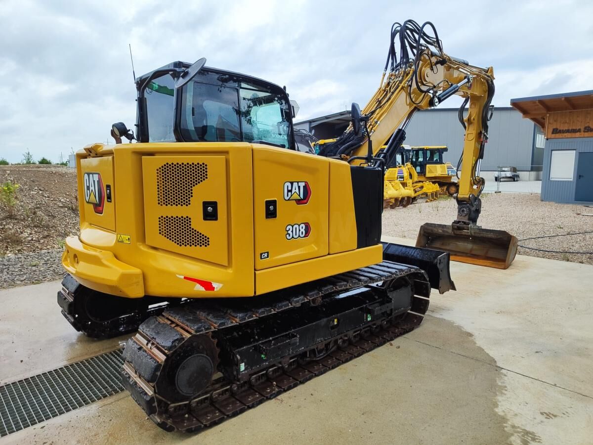 2021 Caterpillar 308 CR mini excavator, rear three-quarter view 2021 Caterpillar 308 CR mini excavator, rear three-quarter view