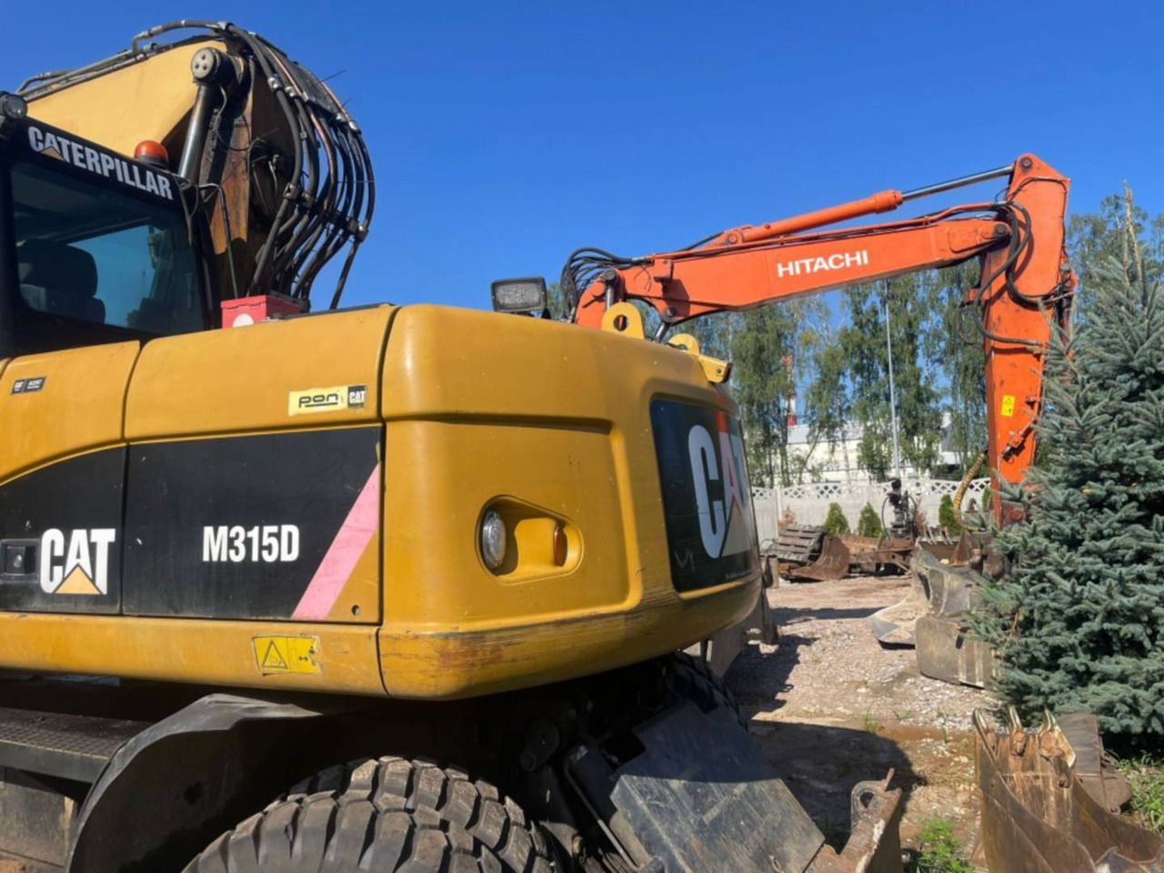 2008 Caterpillar M315D wheel excavator, rear three-quarter view 2008 Caterpillar M315D wheel excavator, rear three-quarter view