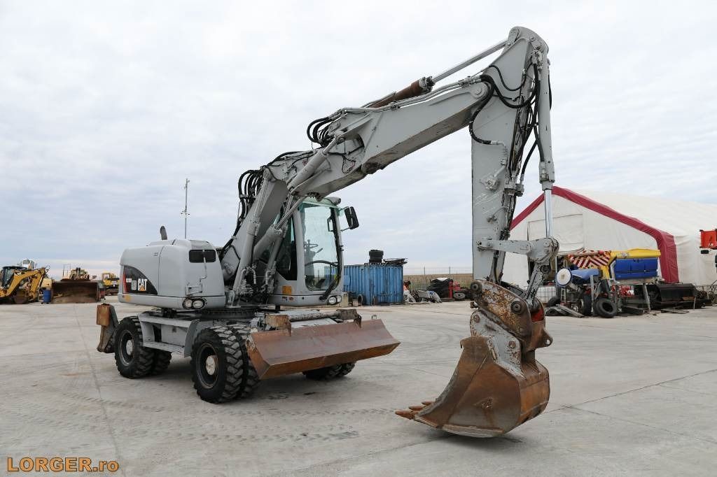 2009 Caterpillar M313D wheel excavator, side profile view 2009 Caterpillar M313D wheel excavator, side profile view