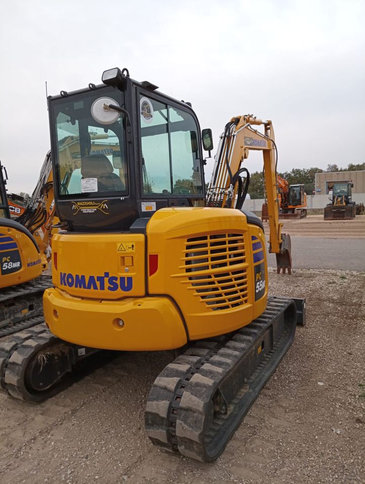 2024 Komatsu PC55MR-5 mini excavator, rear three-quarter view 2024 Komatsu PC55MR-5 mini excavator, rear three-quarter view