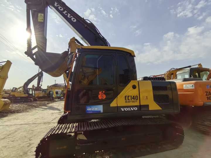 2023 Volvo EC140 crawler excavator, side profile view