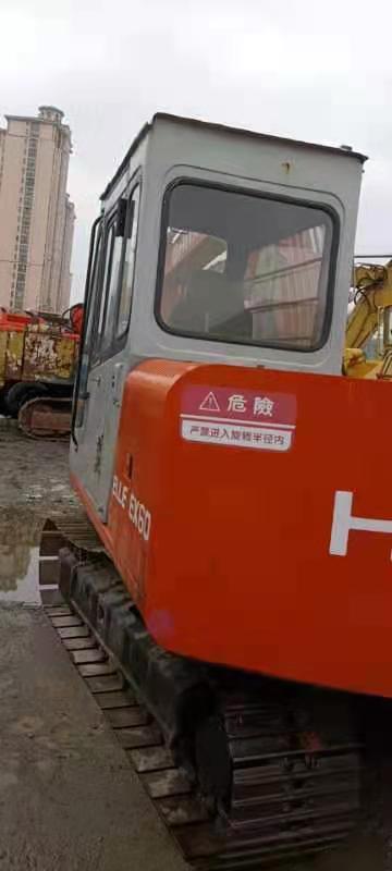 2010 Hitachi EX60 crawler excavator, rear three-quarter view 2010 Hitachi EX60 crawler excavator, rear three-quarter view