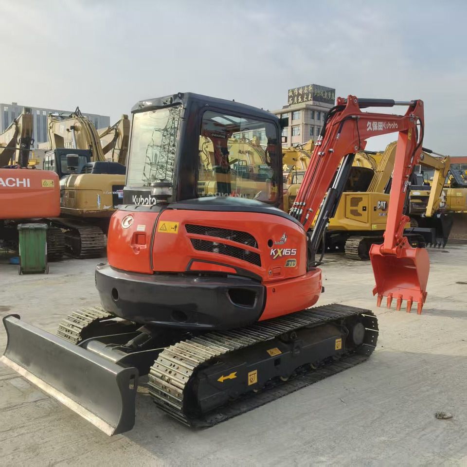 2023 Kubota KX165 mini excavator, three-quarter front view 2023 Kubota KX165 mini excavator, three-quarter front view
