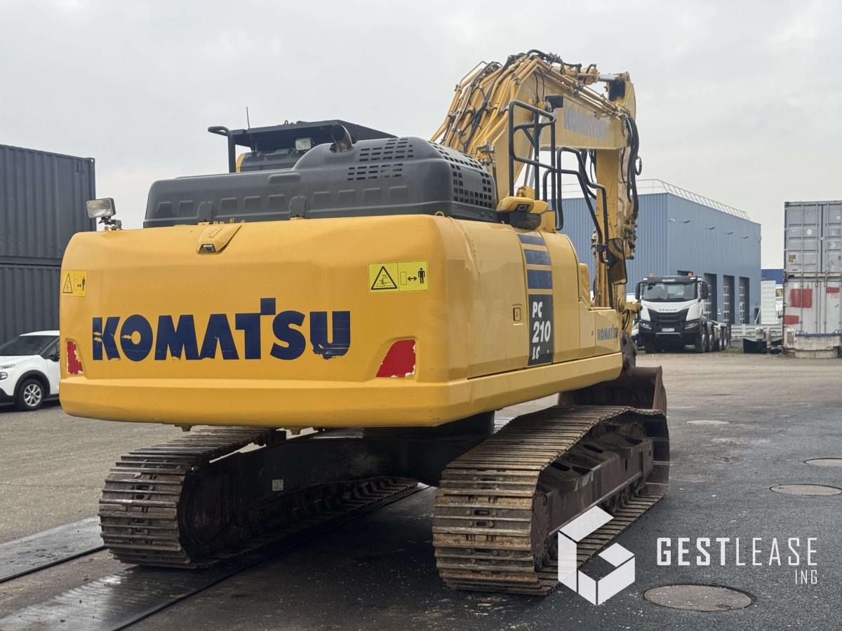 2018 Komatsu PC210LC-11 crawler excavator, rear three-quarter view 2018 Komatsu PC210LC-11 crawler excavator, rear three-quarter view