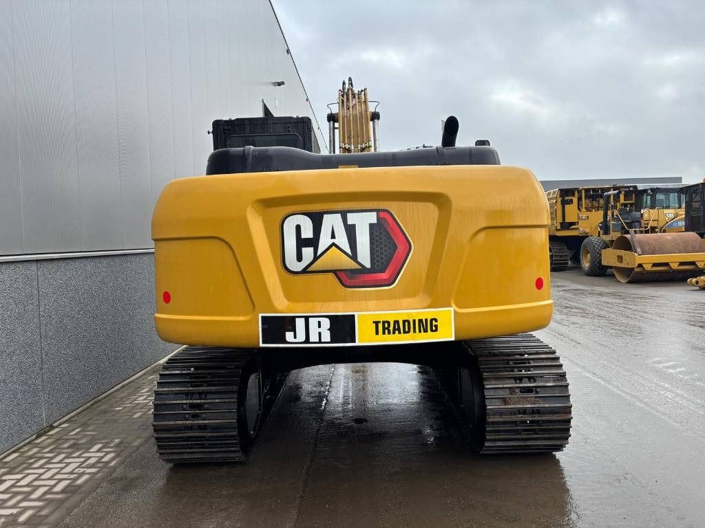 Rear view of a 2026 Caterpillar 323D3 crawler excavator Rear view of a 2026 Caterpillar 323D3 crawler excavator