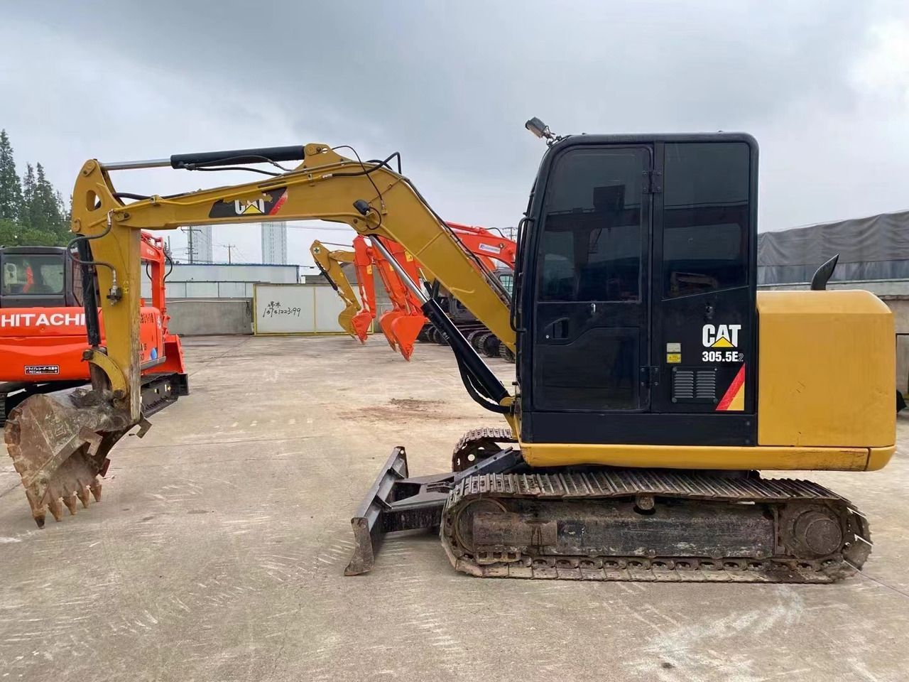 2022 Caterpillar 305.5E excavator, side view