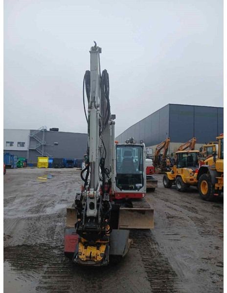 2018 Takeuchi TB290 mini excavator, front view with boom raised 2018 Takeuchi TB290 mini excavator, front view with boom raised