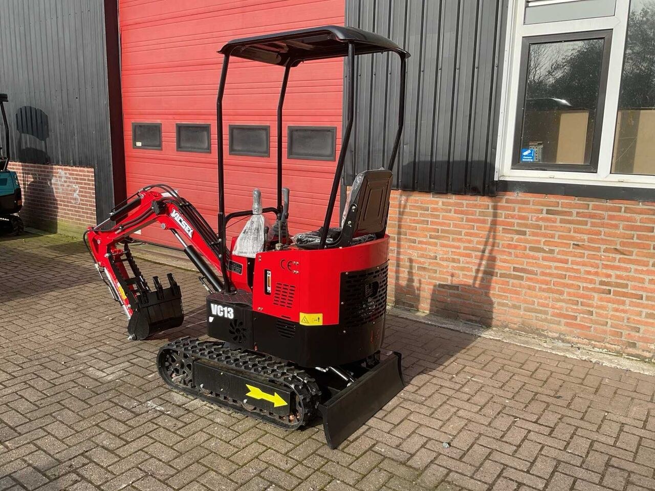 Vicsec VC13 mini excavator, rear three-quarter view Vicsec VC13 mini excavator, rear three-quarter view