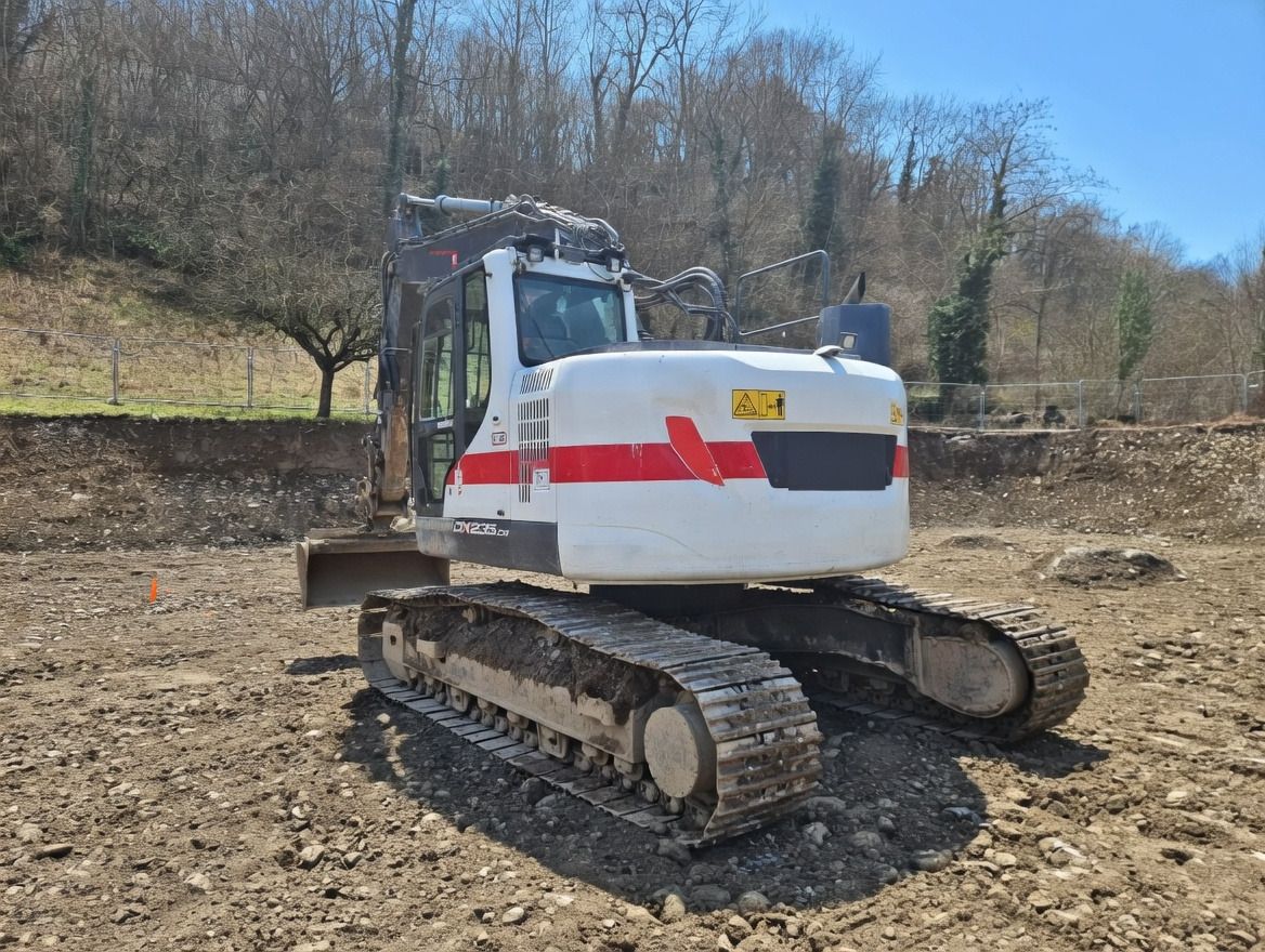 2019 Doosan DX235LCR-5 crawler excavator, rear three-quarter view 2019 Doosan DX235LCR-5 crawler excavator, rear three-quarter view