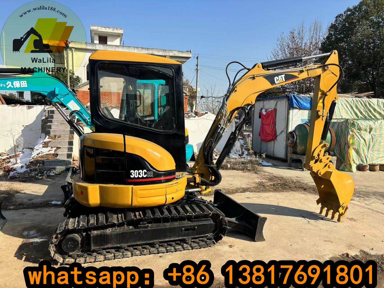 2023 Caterpillar 303CCR mini excavator, side profile view