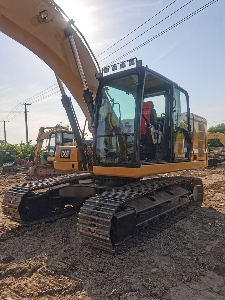 2022 Caterpillar 320GC crawler excavator, front three-quarter view 2022 Caterpillar 320GC crawler excavator, front three-quarter view