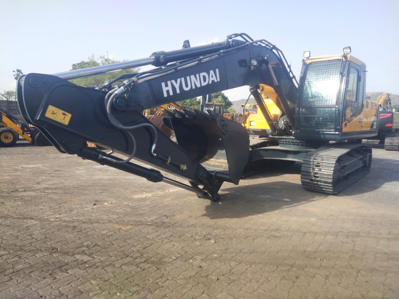 2025 Hyundai R210 crawler excavator, side profile view 2025 Hyundai R210 crawler excavator, side profile view