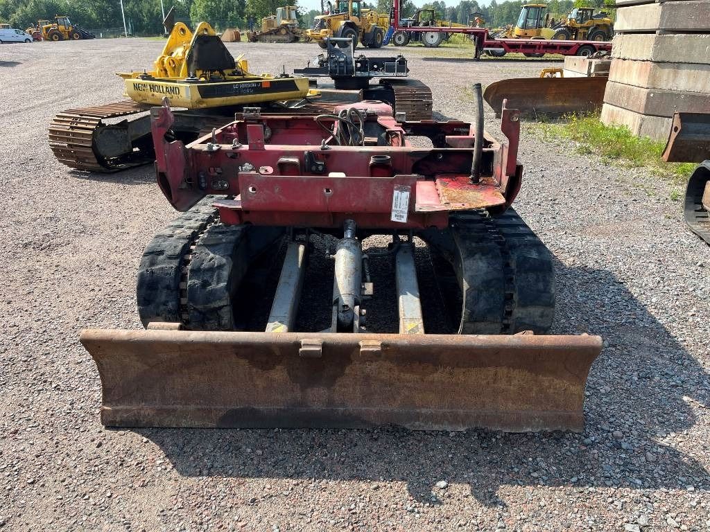 2004 Takeuchi TB145 mini excavator rear view with blade 2004 Takeuchi TB145 mini excavator rear view with blade