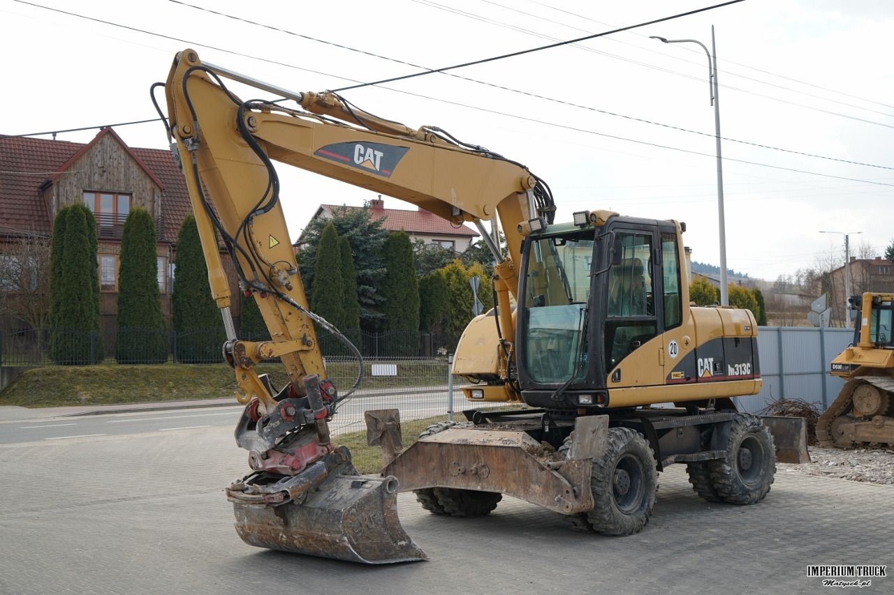 2003 Caterpillar M313C wheel excavator, side view 2003 Caterpillar M313C wheel excavator, side view
