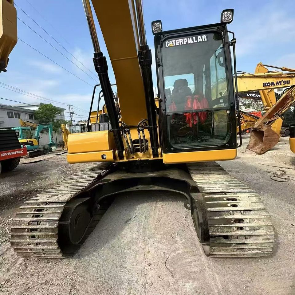 2021 Caterpillar 320GC crawler excavator, front view of cab and tracks