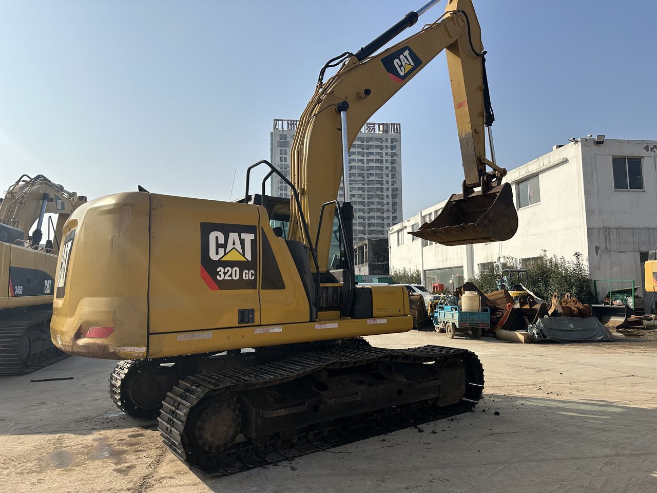 Caterpillar 320GC crawler excavator, rear three-quarter view