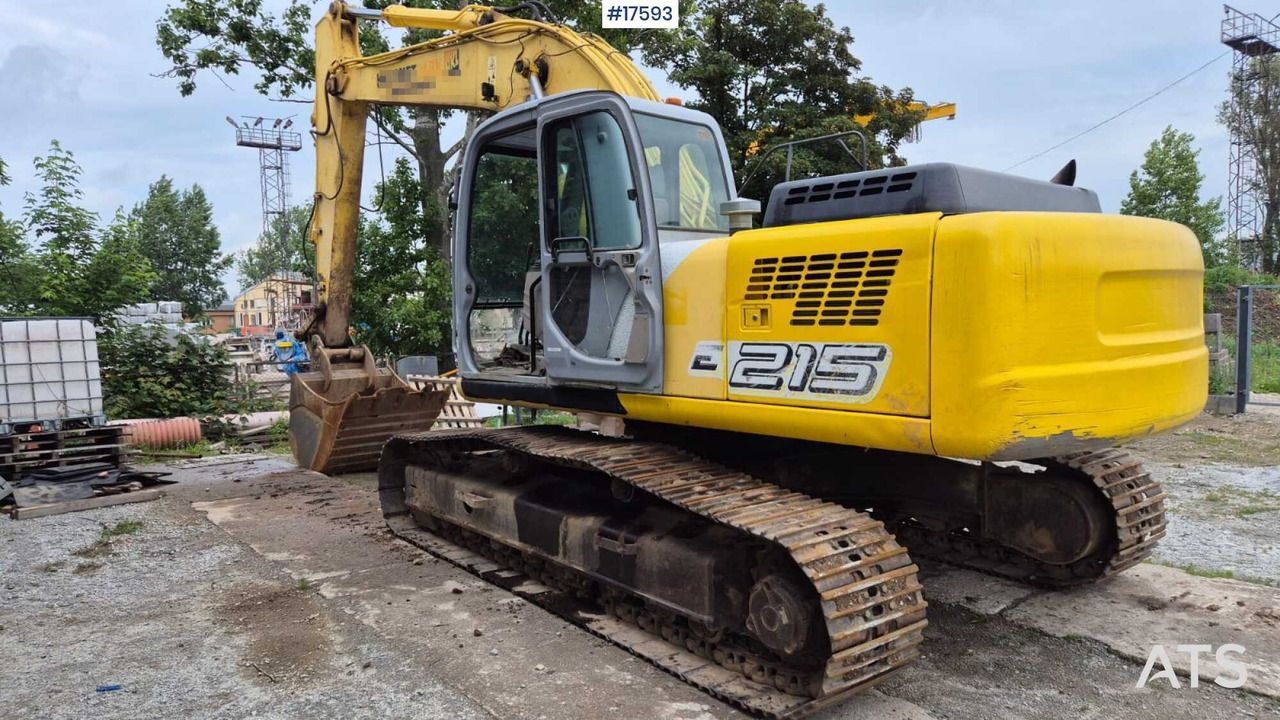 2005 New Holland E215 crawler excavator, rear three-quarter view 2005 New Holland E215 crawler excavator, rear three-quarter view