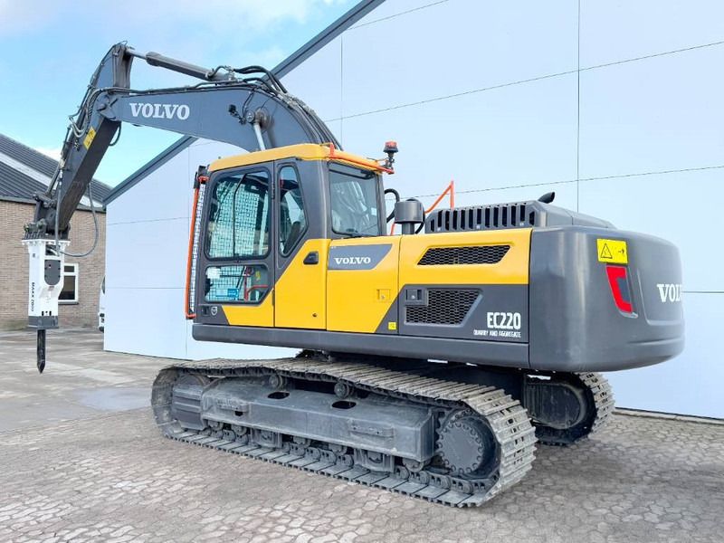 2025 Volvo EC220D crawler excavator with hydraulic hammer, side view 2025 Volvo EC220D crawler excavator with hydraulic hammer, side view
