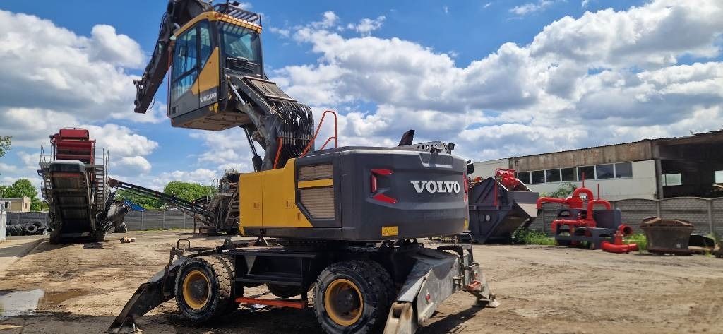 2018 Volvo EW240EMH material handler, rear three-quarter view