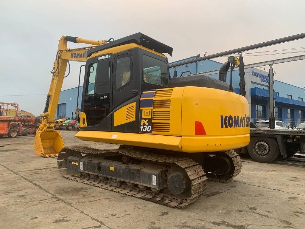 2022 Komatsu PC130 crawler excavator, rear three-quarter view 2022 Komatsu PC130 crawler excavator, rear three-quarter view