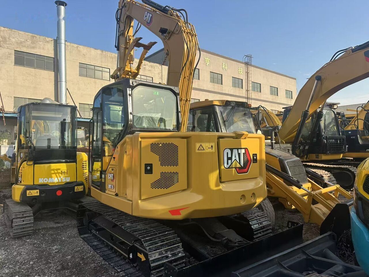 Caterpillar 307.5 crawler excavator, rear three-quarter view Caterpillar 307.5 crawler excavator, rear three-quarter view